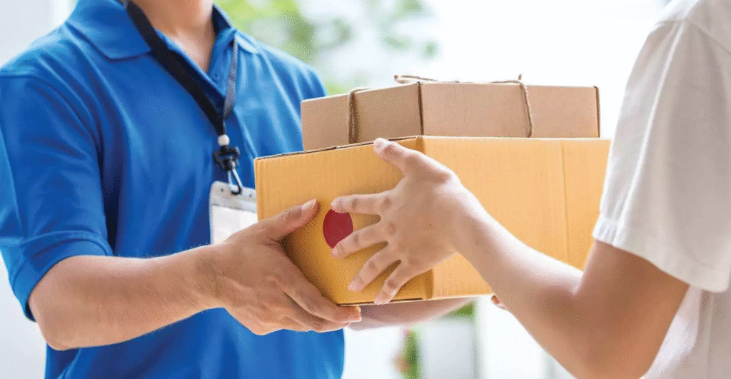 Indian entrepreneur managing an e-commerce business in 2026, packing online orders, and selling products through a laptop from home.